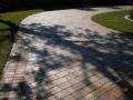 These pavers, view #11, after drying and the application of a satin acrylic sealer the driveway looks brand new!