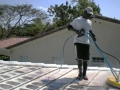 Using a low pressure rotary surface cleaner to gently clean your tile roof.