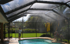 Rinsing the interior of a screened pool enclosure