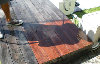 Pressure cleaning this teak deck carefully brings back the wood's rich color.